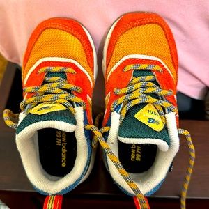 Toddler size 7 NOT 7.5 . New balances orange , blue & green  only worn 3 times .